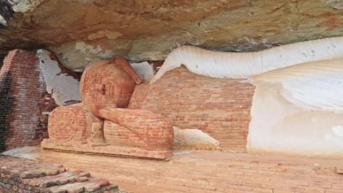 斯里兰卡Pidurangala岩石洞穴的古老砖卧佛像，具有视差效应