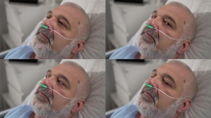 一位老年患者从昏迷中醒来。躺在医院的床上时睁开眼睛，在医院里生病的男性患者睡在床上，。