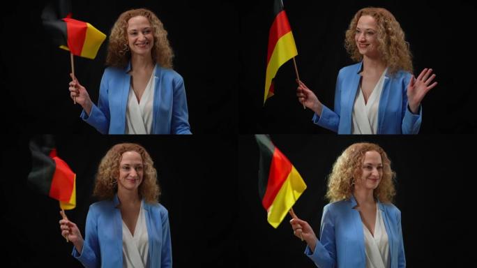 迷人自信的政治家的肖像举着德国国旗在相机闪光灯中四处张望。美丽的女人在黑色背景下为媒体和狗仔队摆姿势