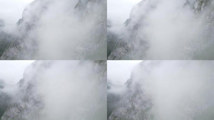 空中无人机拍摄薄雾笼罩的山腰