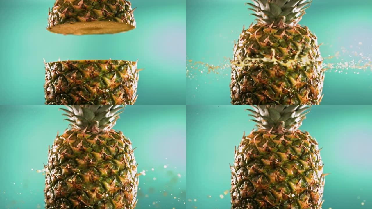 半菠萝掉落并溅在绿松石背景上。食物悬浮概念。慢动作