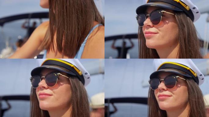 年轻女子在船上晒日光浴，戴着船长的帽子