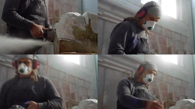 切割石头时戴着防护口罩和耳机的男性雕塑家