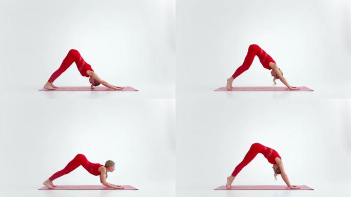 年轻迷人的女孩练习瑜伽，孤立在白色背景的红色运动服。健康生活和身体与心理发展之间自然平衡的概念。全长