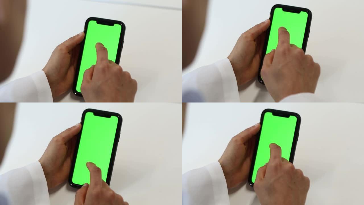 接近手机和人手上的绿色屏幕