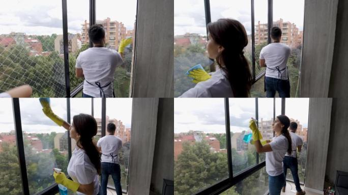 顾客公寓的清洁人员让窗户一尘不染