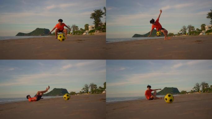 慢动作: 踢足球到海滩上的守门员