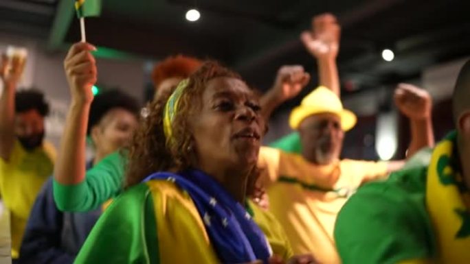 Brazilian team fan celebrating at bar