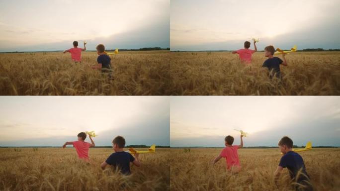 夏天，两个十几岁的男孩在风景如画的金色麦田上奔跑，后视