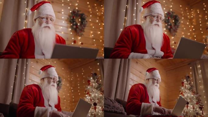 圣诞老人在家远程工作的特写镜头坐在沙发上，笔记本电脑靠近圣诞树，与笔记本电脑一起工作