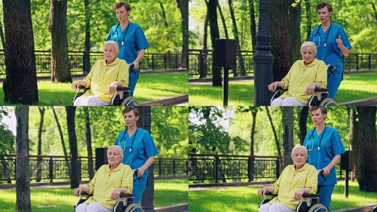 创伤医生推轮椅与资深女病人讨论治疗