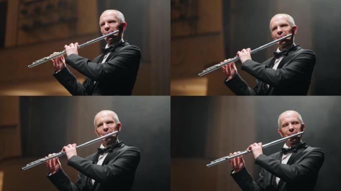 老年长笛演奏家正在用长笛演奏新古典音乐，这是爱乐音乐厅的音乐家肖像