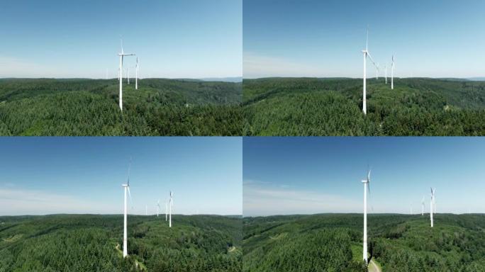 空中无人机在森林附近拍摄风车