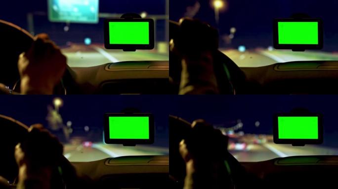 LD人在夜间借助导航设备在高速公路上驾驶汽车