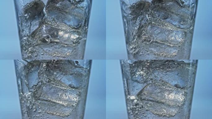 SLO MO LD苏打水倒在玻璃杯中的冰上