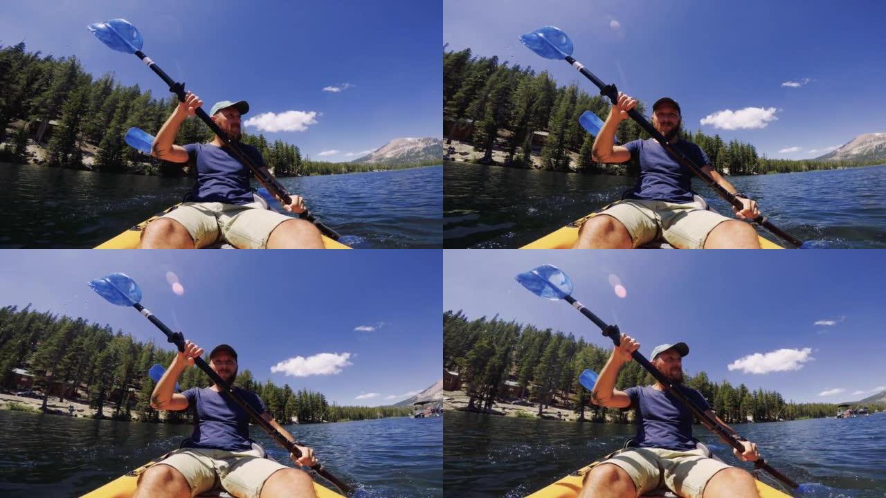 一个男人在平静的湖中划皮艇的自拍照: 美国的暑假