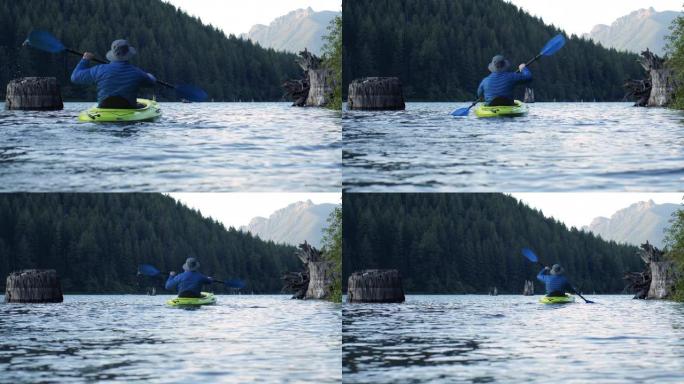 在原始的高山湖泊慢动作中逃离大自然的皮划艇冒险