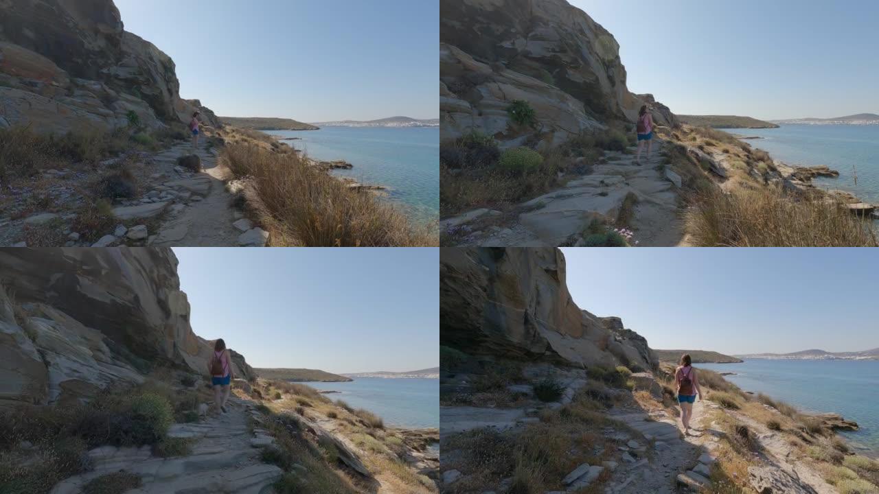 女性在步行小径上探索海岸线的POV视角