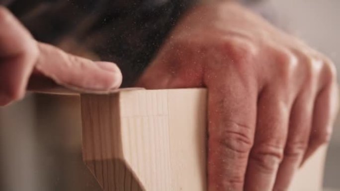 SLO MO Hands of a male carpenter sanding the edges