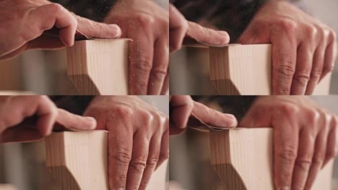SLO MO Hands of a male carpenter sanding the edges