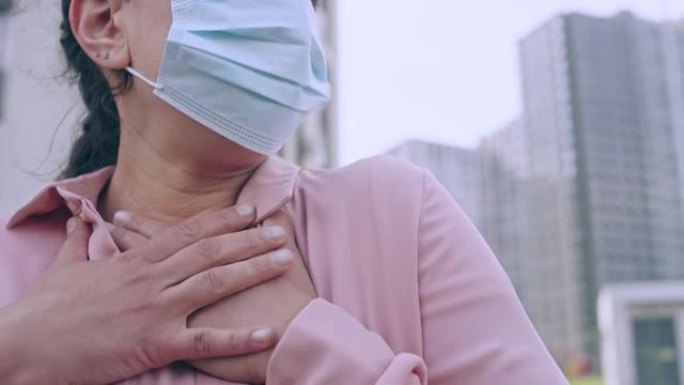 患有呼吸急促，新型冠状病毒肺炎的面罩咳嗽的妇女