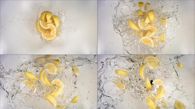 爆炸柠檬和爆裂水和切片的超慢动作