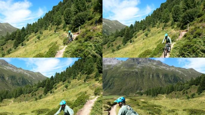 沿着高山小路骑山地自行车的女人