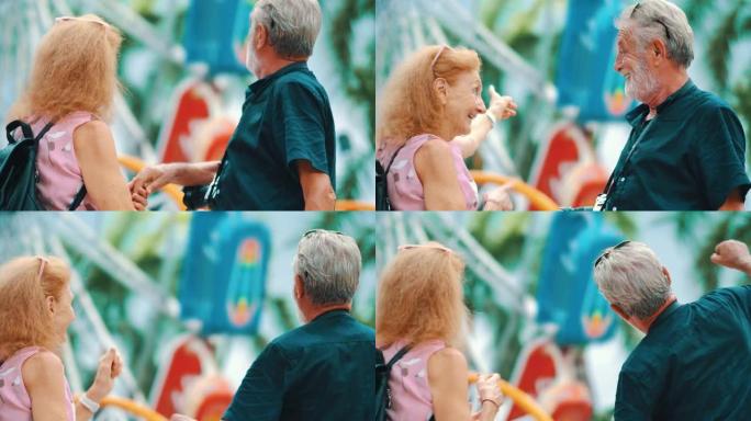一对白人老年夫妇一起在游乐园度过一天。