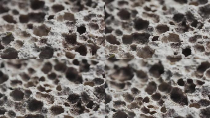 Macro slide shot，浮石的表面，类似于月球上的陨石坑。