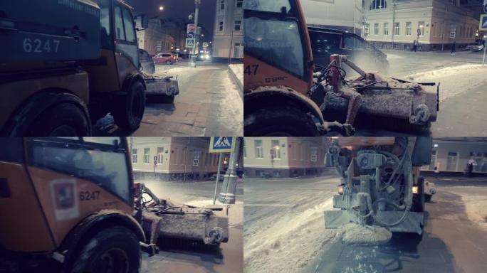 扫雪车沿着积雪覆盖的人行道行驶并扫雪