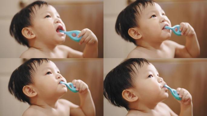 小男孩试图清洁牙齿。