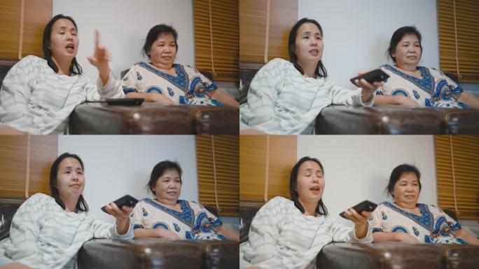亚洲女性和母亲晚上看电视