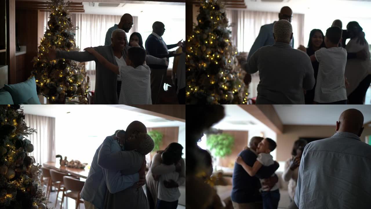 家庭在圣诞节期间在家中拥抱