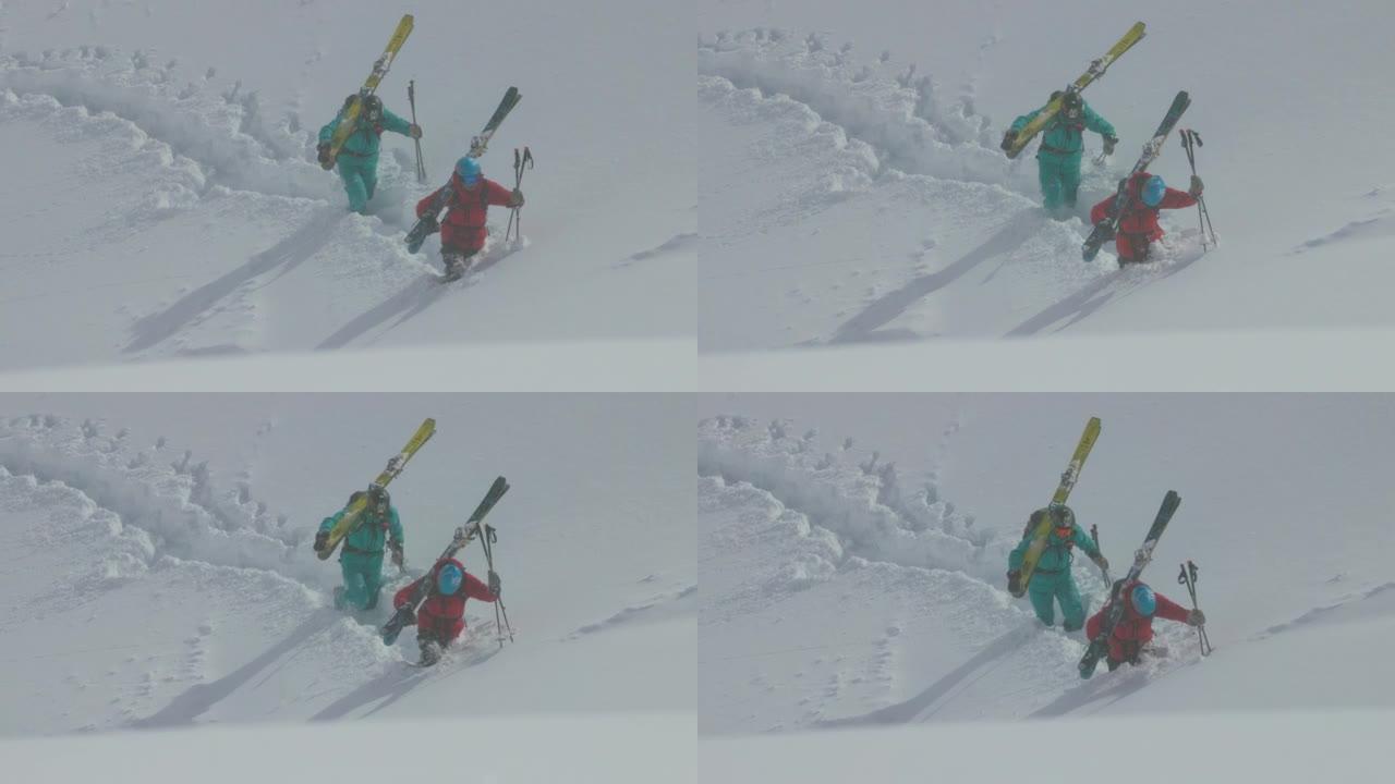 两名滑雪者在雪中跋涉的慢动作镜头