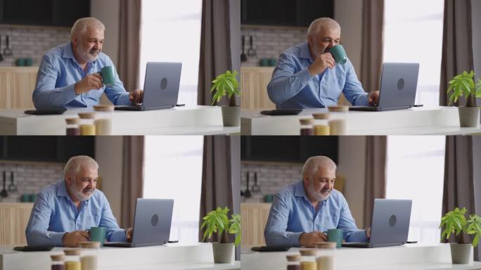 老人正在用笔记本电脑上网，在网上聊天中发送消息，独自坐在厨房里喝茶