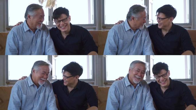 亚洲资深父亲和他的成年儿子幸福的微笑坐在家里。