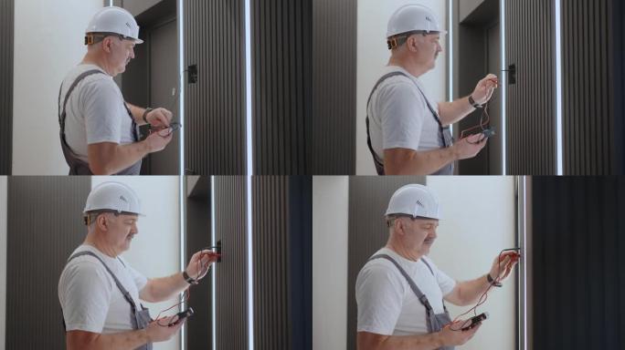 摄像机在安装和维修后用现代家居系统在电气后面移动检查灯具墙壁控制单元的操作