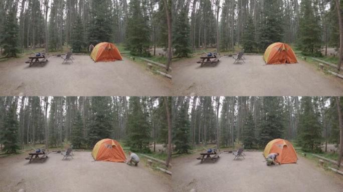 露营地中夫妇搭建帐篷的延时视图