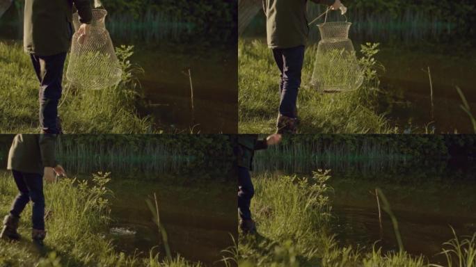 fisher boy将小鲤鱼放在鱼缸中，在夏季早晨钓鱼，4K，Prores
