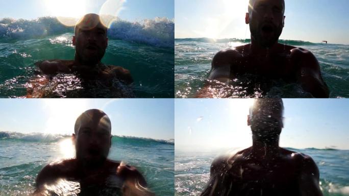 夏天在海里浮潜。男子手持可穿戴相机潜入大海