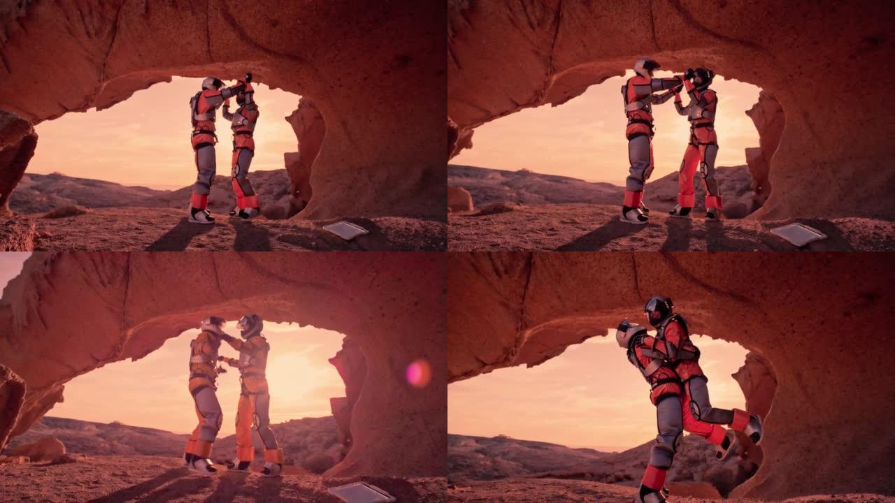 火星红色星球上的两名宇航员。击掌并庆祝科学发现