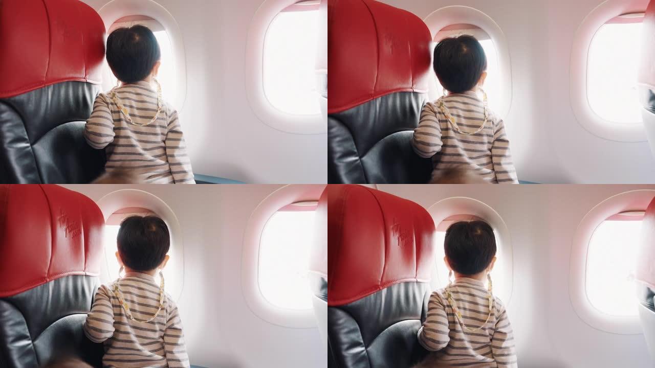 亚洲父母有两个儿子乘商用飞机旅行