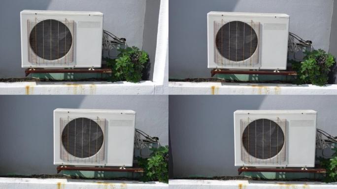 大型空调压缩机挂在墙上。从右向左倾斜。