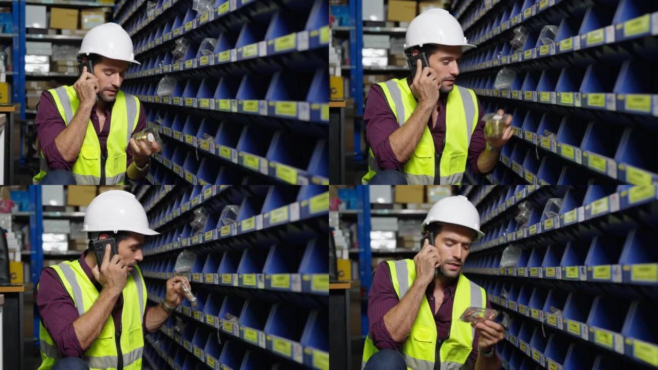 4k高加索人工人在工厂储藏室工作时与主管通话。