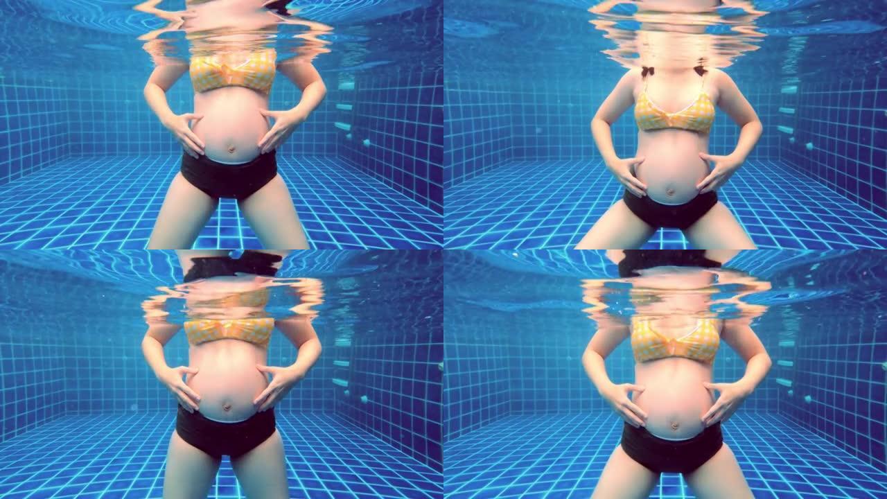 孕妇在游泳池锻炼。