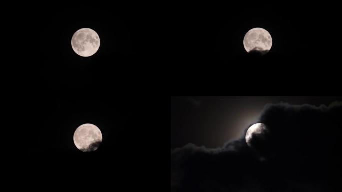 夜间乌云在超级月亮上空移动的4k实时镜头。