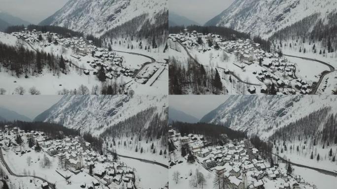 空中无人机拍摄冬季积雪覆盖的小山城
