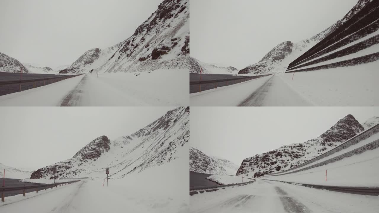 POV汽车在雪中行驶: 挪威的山口
