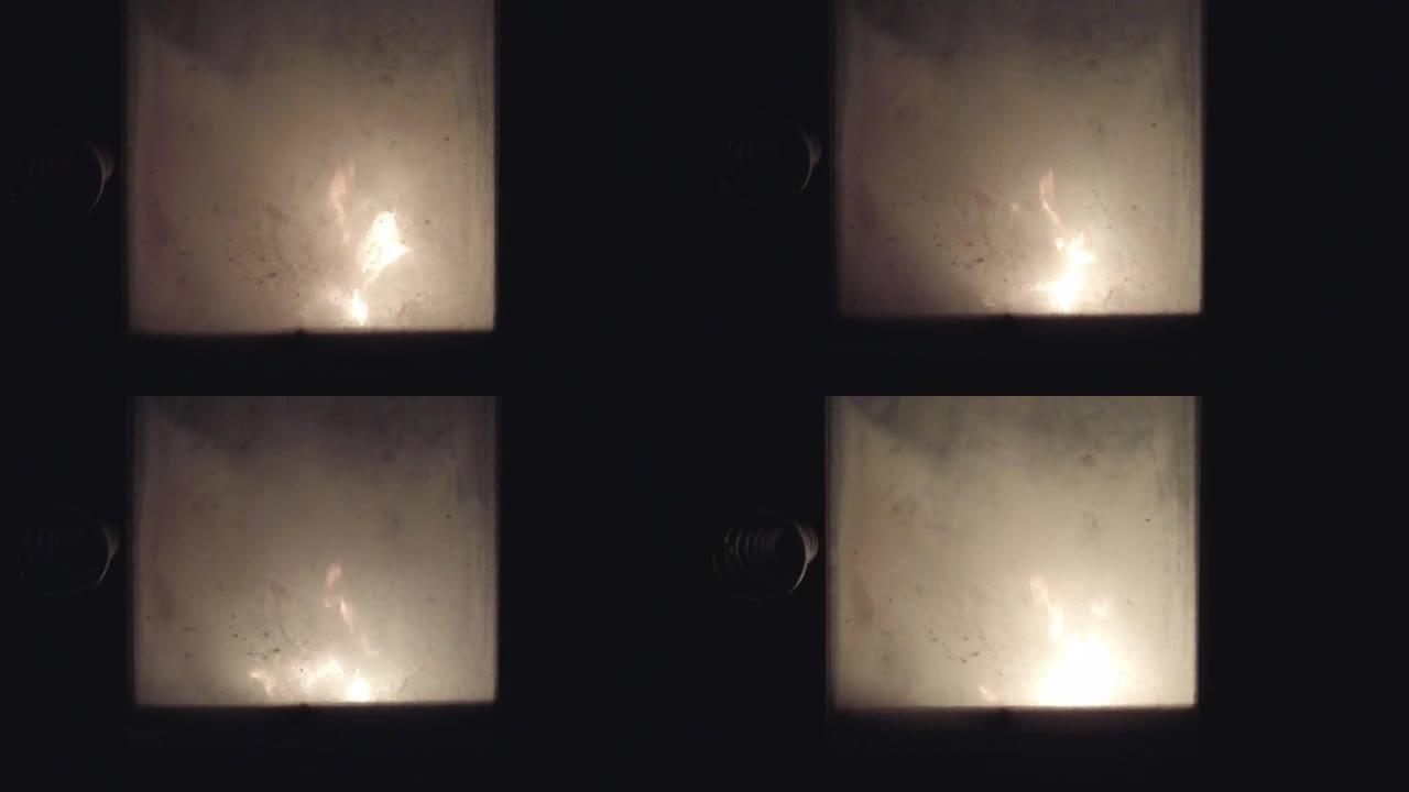 烟熏玻璃后面的桑拿浴室起火的细节镜头