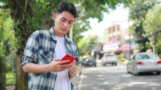 亚洲男子正在等待Uber出租车